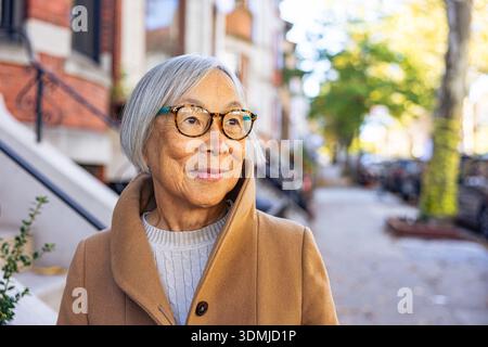 Portrait of A Calm and Stylish Senior Asian Woman Stock Photo
