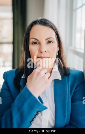 Woman professional business executive looking confident and serious Stock Photo