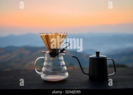 Morning Pour-Over Coffee with a Mountain Sunrise View Stock Photo
