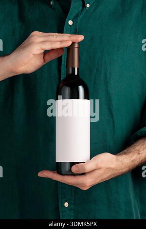 Red wine bottle mockup, white neutral label, on background, branding mockup, graphic template, advertising display Stock Photo