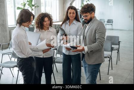 At business meeting. Group of people are working in the office together as a team. Stock Photo