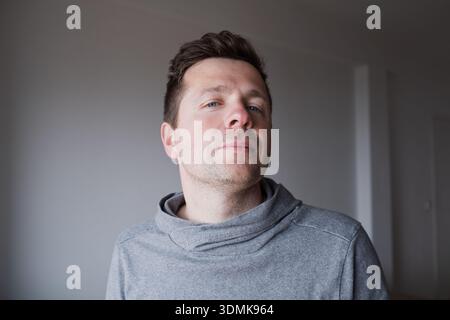 Arrogant and narcissistic middle-aged man looking directly at the camera with pride Stock Photo