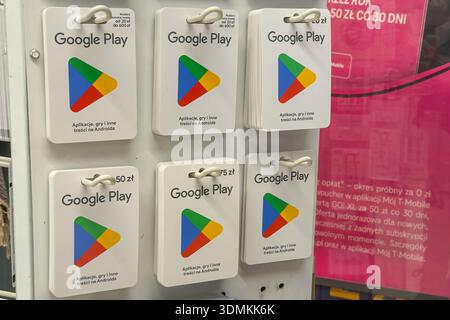 Poznan, Poland - November 22, 2025: Multiple Google Play gift cards in different denominations available for purchase on a retail display, symbolizing Stock Photo