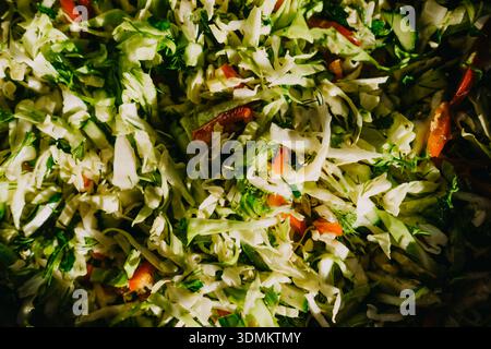 Enjoy a Freshly Chopped Green Salad Mix that features a delightful variety of Colorful Veggies Stock Photo