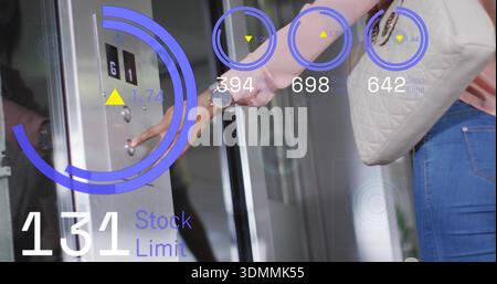 Pressing woman in pink blouse at elevator, stainless panel showing AR 131 Stock Limit, copy space Stock Photo