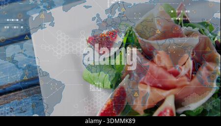 Displaying pink rose bud and halved figs on blue wooden tabletop with digital world map overlay Stock Photo