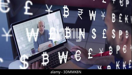 Watching red-shirted man typing at desk, laptop showing senior in sweater, headset, paper, currency Stock Photo