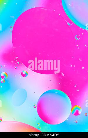 Soft abstract pink liquid texture with small white bubbles and subtle light Stock Photo