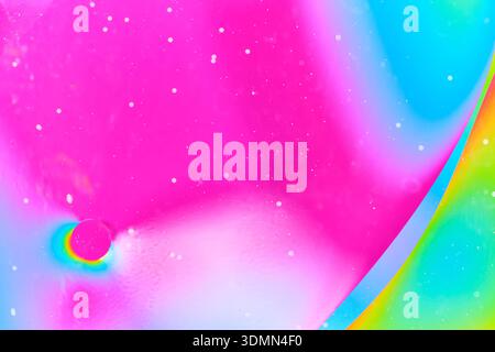 Large magenta oil circle on a soft blurred pink and white background Stock Photo