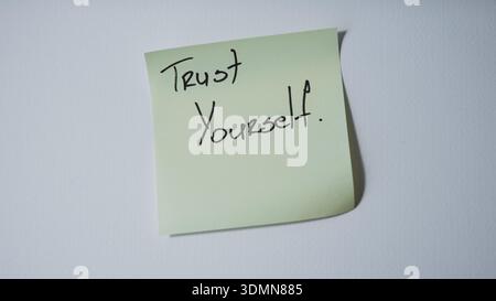 Trust yourself motivational message on sticky note minimal concept background Stock Photo