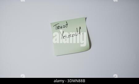 Trust yourself motivational message on sticky note minimal concept background Stock Photo