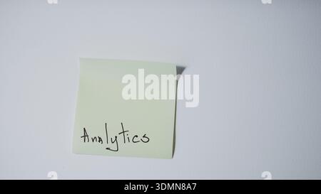 "Analytics" Handwritten on Green Sticky Note — Data Analysis and Business Intelligence Concept Stock Photo