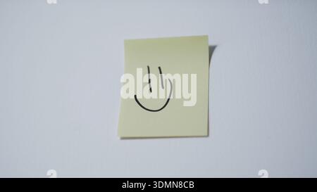 Smiley Face Drawn on Yellow Sticky Note — Happiness and Positive Emotion Concept Stock Photo