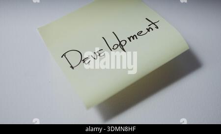 Development Handwritten on Sticky Note Stock Photo