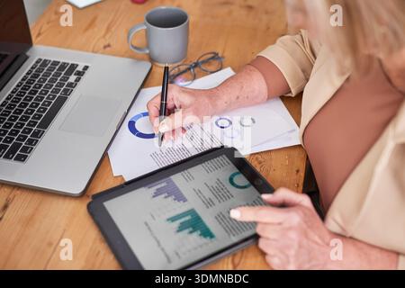Professional Business Analysis At Desk With Tablet And Laptop Documents On Wooden Table Stock Photo