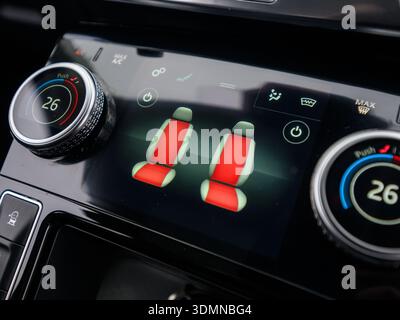 Close-up of heated seat controls on modern car climate control panel Stock Photo