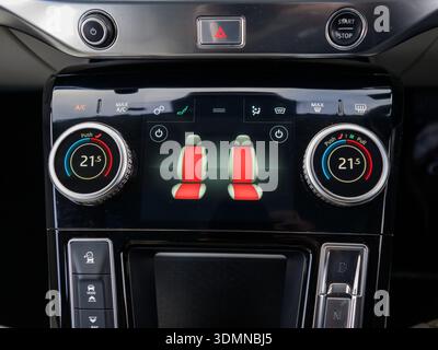 Close-up of heated seat controls on modern car climate control panel Stock Photo