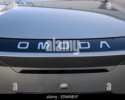 Derby, UK - February 06, 2026: Omoda car emblem on front hood close up Stock Photo