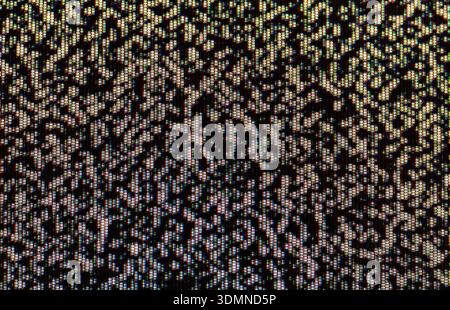 Abstract analog RGB static dark noise on an LED screen, macro extreme closeup of multicolored subpixels. Glitch, no signal, TV snow color interference Stock Photo