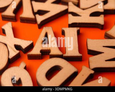 The letters AI in the image are made of wooden blocks and represent the abbreviation for Artificial Intelligence. Stock Photo