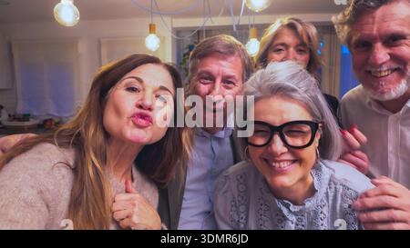 Group of friends taking fun selfie at celebration Stock Photo