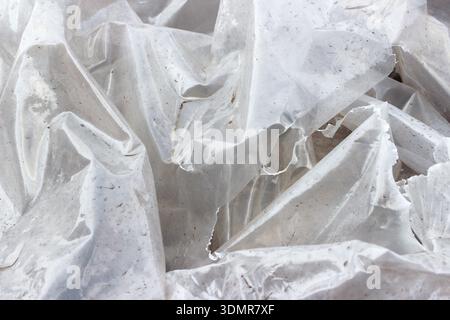Abstract white texture of plastic for the background. Wrinkle plastic texture, torn abstract creased white plastic background. Stock Photo