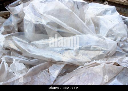Abstract white texture of plastic for the background. Wrinkle plastic texture, torn abstract creased white plastic background. Stock Photo