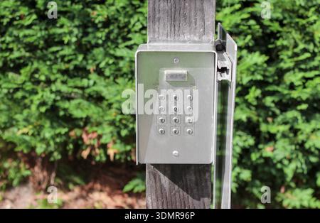 Secure password on keyboard for opening the gate door. Password code Security keypad system protected on private property. The security combination. Stock Photo