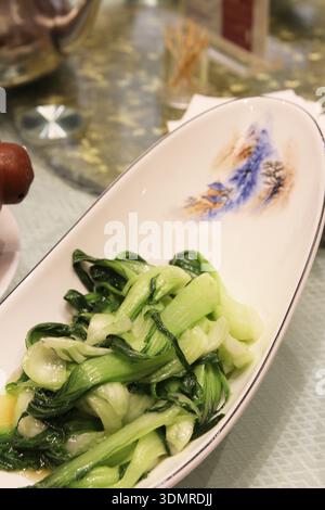 Stir-fry bok choy and served in a nice bowl at a restaurant, Dunhuang, Gansu Province of China Stock Photo