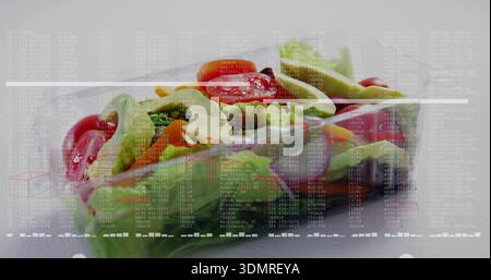 Showing clear plastic clamshell with salad on white table showing lid condensation and data overlay Stock Photo