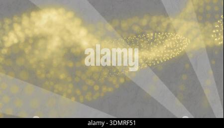 Flowing golden particle stream forming across textured gray backdrop with radial pale-gray beams Stock Photo