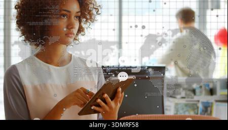Holding tablet, woman wearing color-block blouse analyzing data with stylus in open office, overlay Stock Photo