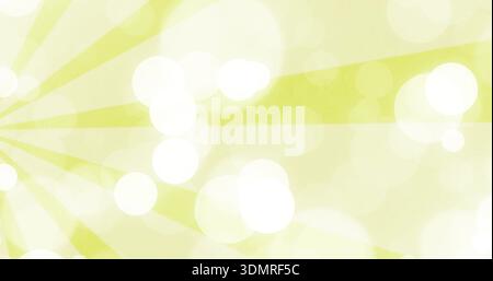 Radiating lime sunburst rays sweeping over digital wallpaper, showing soft bokeh and paper grain Stock Photo