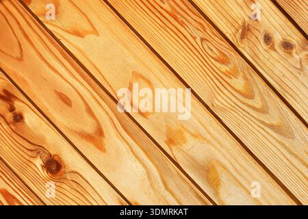 Natural wooden plank texture background closeup. Rustic wood pattern and material surface detail with diagonal boards arrangement. Stock Photo