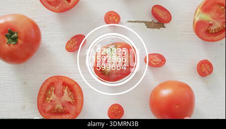 Displaying centered halved tomato showing overlay on pale board, with whole tomatoes, cherry slices Stock Photo