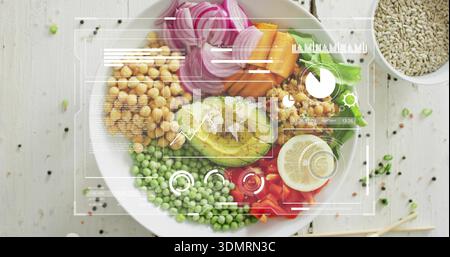 Displaying white ceramic bowl featuring halved avocado and chickpeas on pale wooden tabletop, HUD Stock Photo