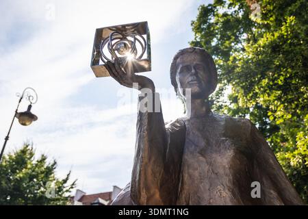 Statue of Maria Sklodowska Curie on a Church Street on the New Town of Warsaw city, Poland Stock Photo