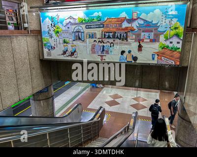 Shanghai, China, Chinese Advertising Travel Poster on Display,  with slogan: "Strolling around Mininlu Town" Chinese people Riding on metro train Stock Photo
