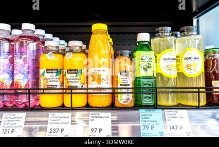 Samara, Russia - March 24, 2025: Various fruits beverages in plastic bottles on display at the VkusVill grocery store. Different VkusVill fruit juices Stock Photo