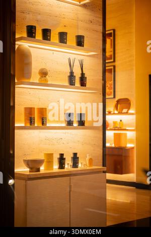 Milan, Italy - 2026, 3 Feb: Acqua di Parma fragrances and home scents elegantly displayed in a glowing, modern boutique window with luxurious golden a Stock Photo