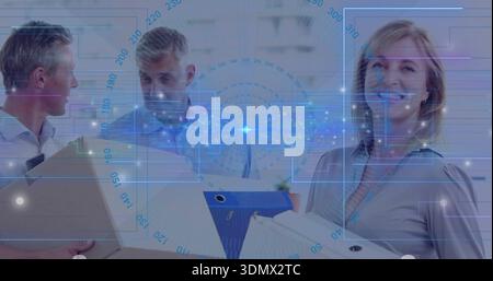 Smiling female on right wearing blouse holding blue binder, moving boxes in office HUD, copy space Stock Photo