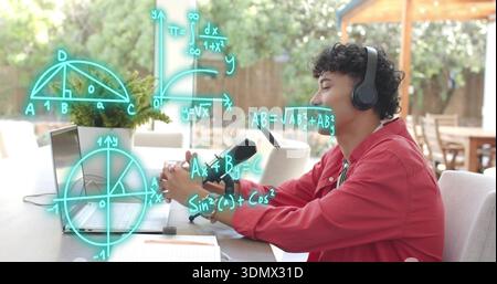 Speaking man wearing red shirt and headset using laptop mic showing math diagrams at backyard patio Stock Photo