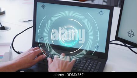 Typing adult hands wearing long-sleeve shirt on laptop keys at white desk, HUD graphic and monitor Stock Photo