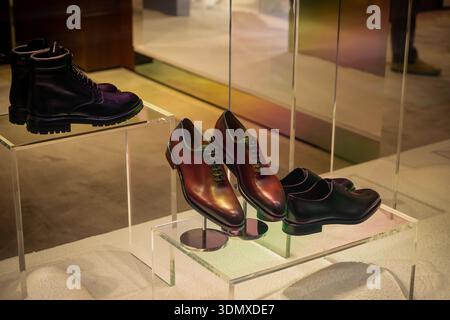 Milan, Italy - 2026, 3 Feb: Ferragamo FW25 display features elegant men’s leather shoes and boots, highlighting luxury craftsmanship and sophisticated Stock Photo