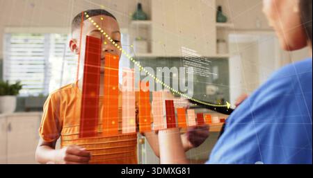 Standing boy in orange shirt viewing AR bar chart in home-kitchen, woman in blue-top touching Stock Photo