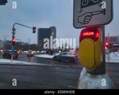 Close Up of a Pedestrian Traffic Light Button at Ors Vezer Tere Budapest Zuglo with Red Glowing Varjon Text Signaling Wait for Safety in Snowy City Du Stock Photo