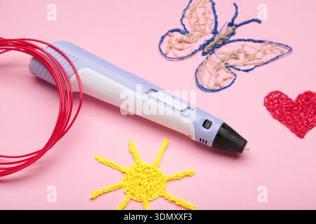 3d handle pen and 3d painting figures on pink background Stock Photo