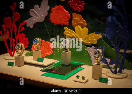 Milan, Italy - 2026, 3 Feb: Rolex FW25 luxury watches elegantly displayed with vibrant floral backdrop, highlighting premium craftsmanship and modern Stock Photo