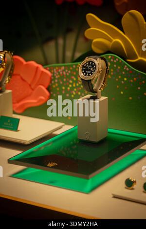 Milan, Italy - 2026, 3 Feb: Rolex FW25 luxury watch showcased on an elegant green display, highlighting premium design and vibrant fashion week style Stock Photo