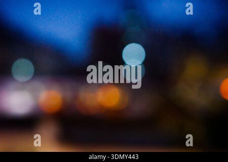Abstract city lights bokeh background at night Stock Photo